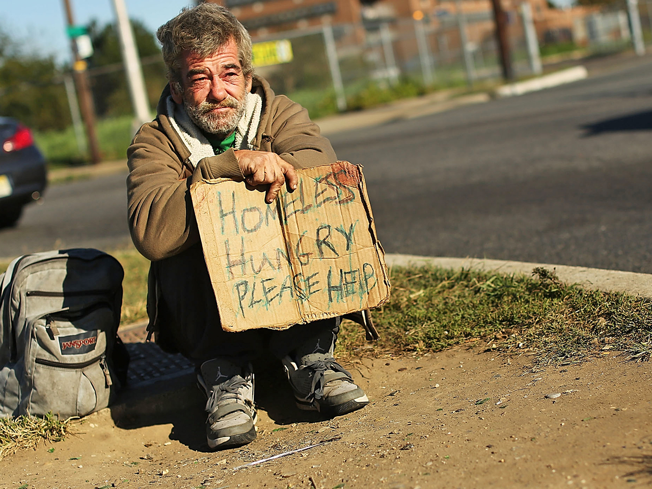 CAMDEN, NJ - OCTOBER 11: A homeless man named Bob waits for donations from ...